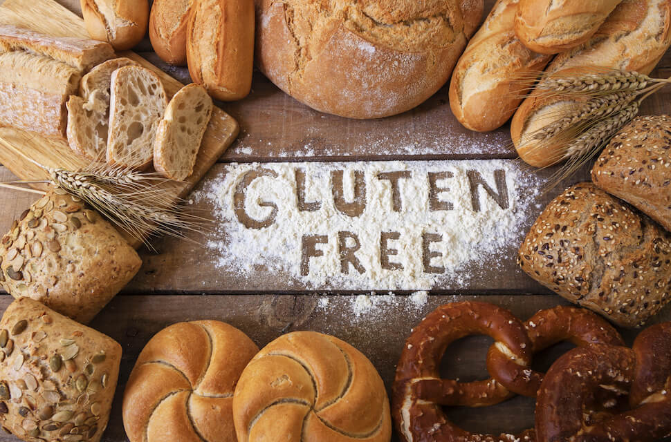 gluten free survival food on a wooden background that says gluten free